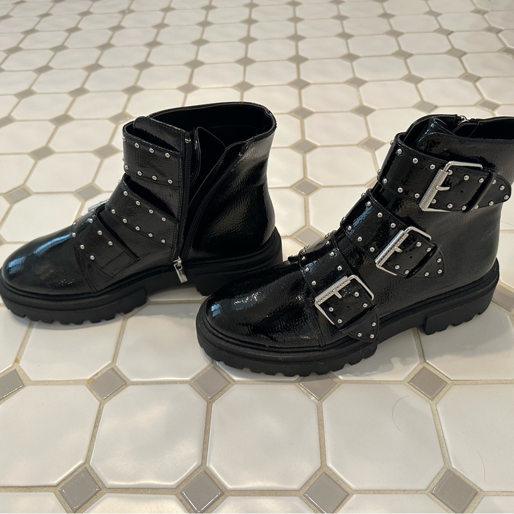 Black patent embellished zip up bootie. Brand new, no tags. Size 9